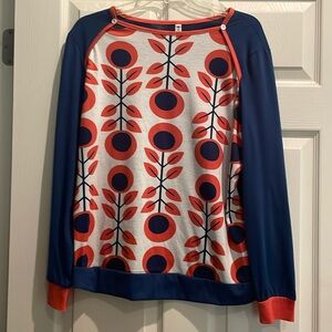 Vibrant orange and navy colored top. Thin material for comfort in warm weather